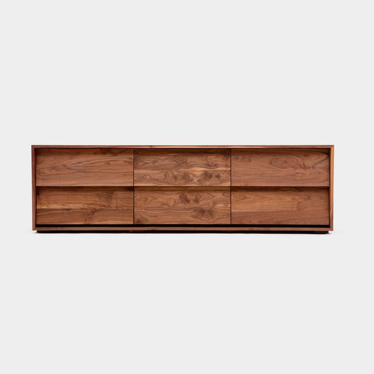 the sideboard is made out of wood and has four drawers, one with two open doors