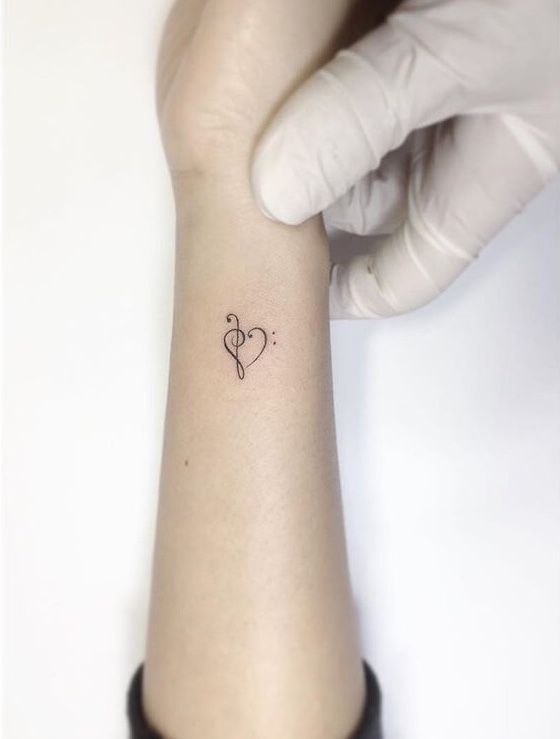 a person with a small tattoo on their wrist