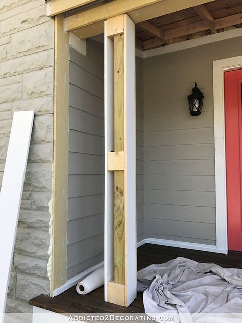 a red door is open on the side of a house