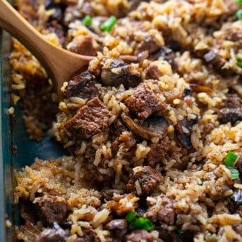 a casserole dish with meat and rice in it