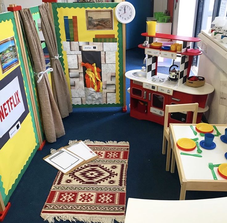 a child's playroom with toys and furniture