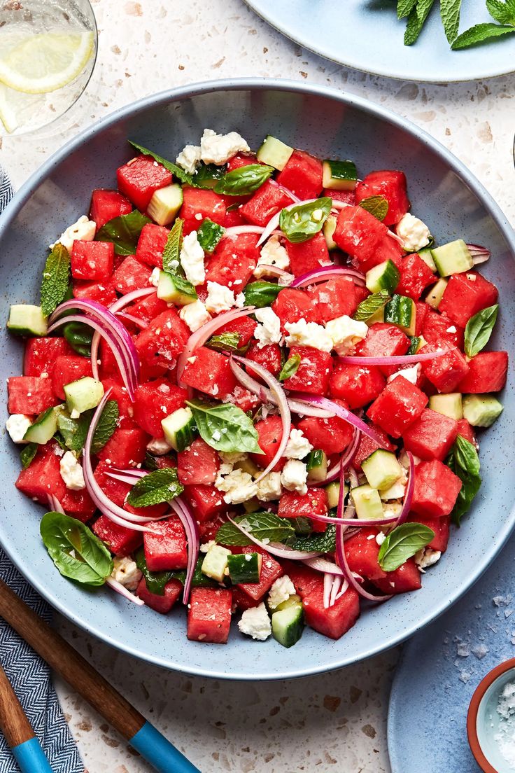 watermelon and onion salad in a blue bowl