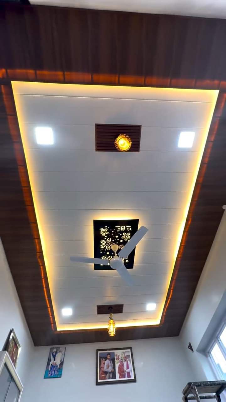 an overhead view of a ceiling with lights and pictures on the wall