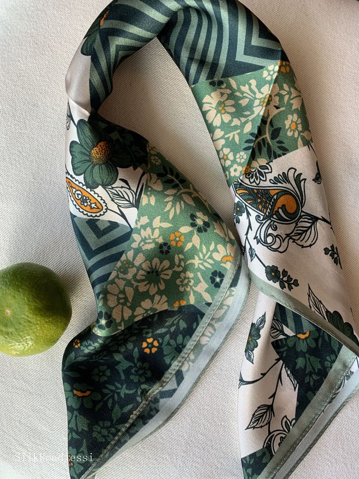 Versatile green floral natural mulberry silk small square scarf with size of 53 cm x 53 cm / 20.8 in x 20.8 in. Art-deco prints, with a lavish array of patterns ranging from ornate paisleys to simple stripes. Bold, and carefree, yet complemented by the sophisticated shades of green and white, embellished with a bright orange. Soft, smooth, and lustrous silk charmeuse, soft warm colors, one sided quality print, fabric breathable and skin-friendly feels very comfortable to wear. Can style in different ways: wear this scarf as a small neck scarf, as a hair tie scarf, as a headband, as a bag accessory, as a wrist band...or style it any way you want with your own sense of creativity! Suitable for all seasons and is a lovely gift idea for special occasions. Care Instructions: Pure silk is a type Scarfs Silk, Multicolor Rectangular Silk Scarf For Spring, Trendy Rectangular Silk Scarf For Spring, Rectangular Scarves As Spring Gift, Rectangular Scarves For Spring Gift, Green Scarf As Spring Gift, Green Scarves For Spring Gift, Green Scarf For Spring Gift, Trendy Green Scarves As Gift