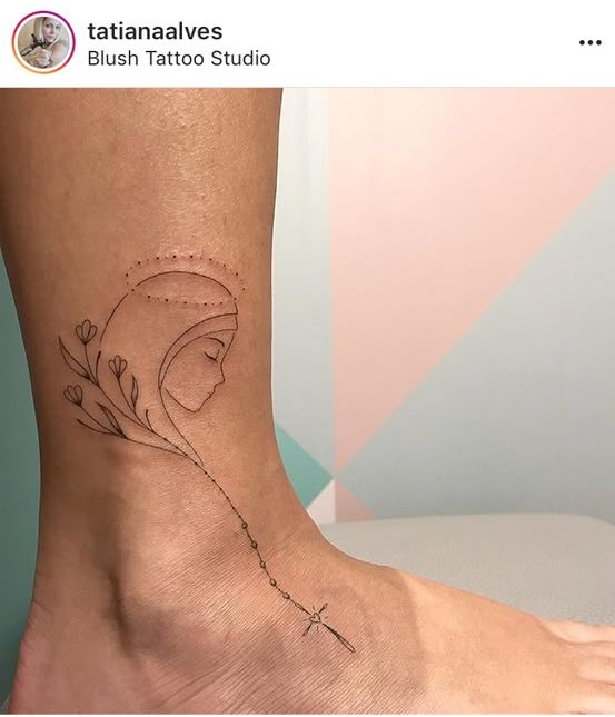 a woman's foot with a tattoo on it