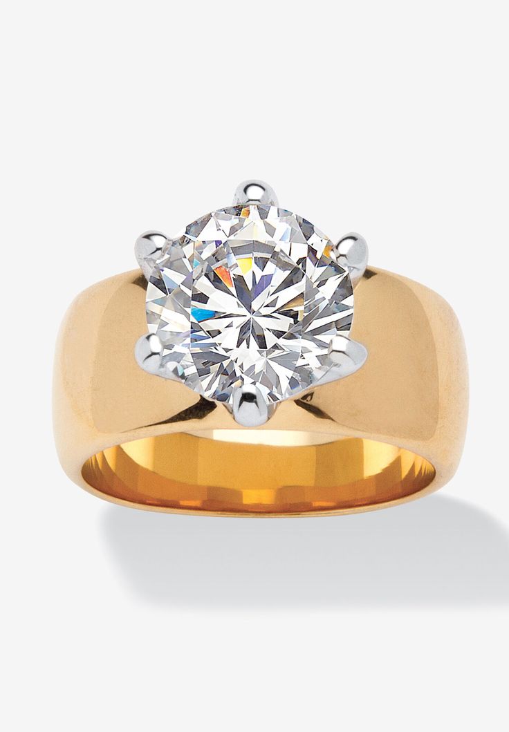 a yellow gold ring with a diamond in the center