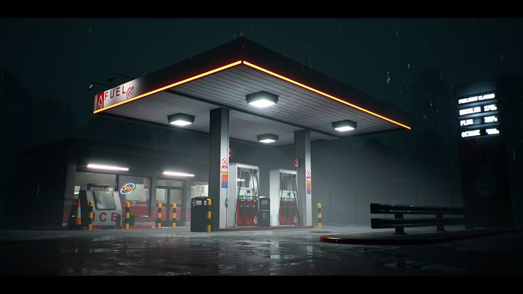 an empty gas station at night with lights on