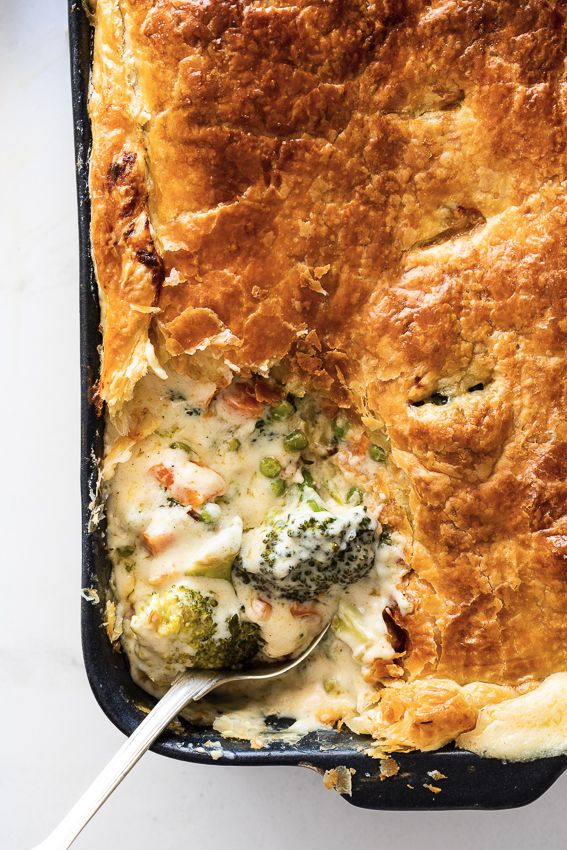 a casserole dish with broccoli and cheese