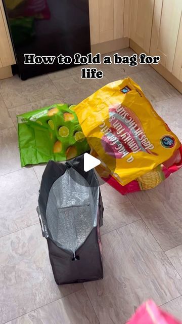 three bags sitting on the floor next to each other in front of a stove top oven