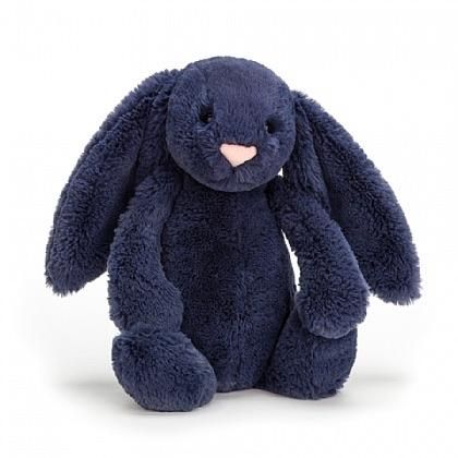 a dark blue bunny stuffed animal on a white background