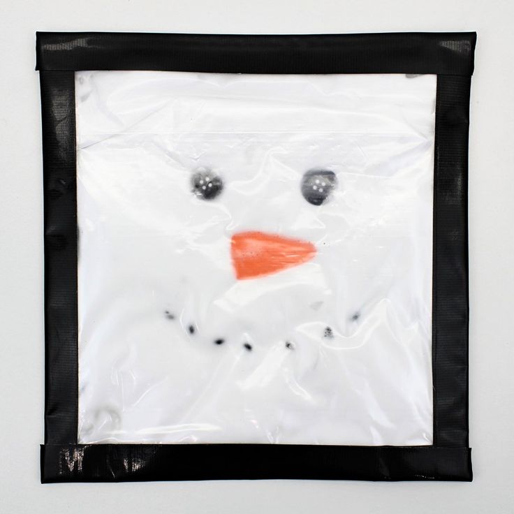 a plastic bag with a snowman drawn on it's face in the shape of a square