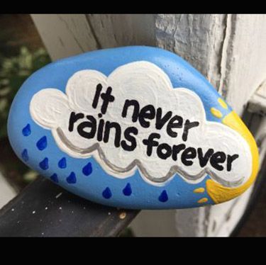 a painted rock that says it never rains forever