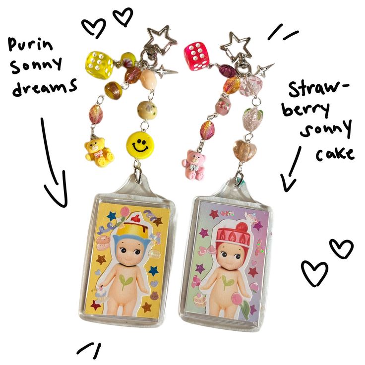 two key chains with charms attached to them