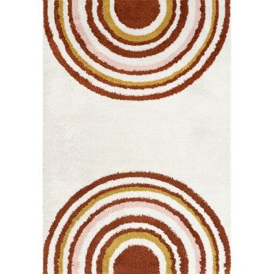 two rugs with circles on them in brown and white