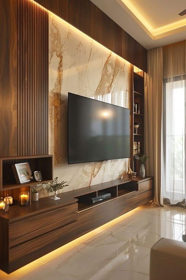 a living room with a large television on the wall and some candles in front of it