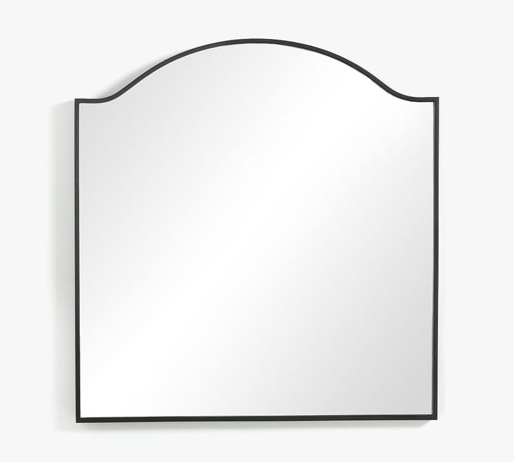 a mirror that is on the wall with a black frame and an oval shape around it