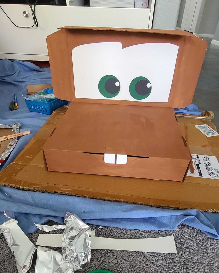 an open cardboard box with eyes on it