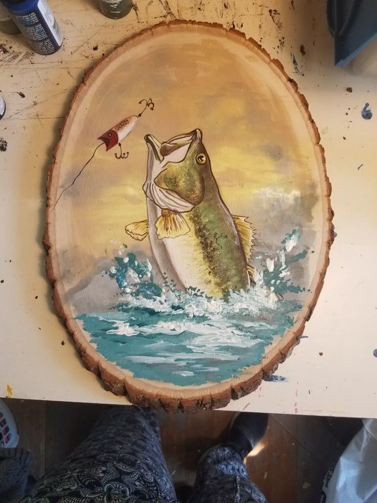 a painting of a fish jumping out of the water