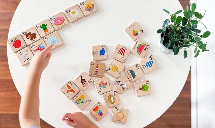 a wooden box with letters and animals in it