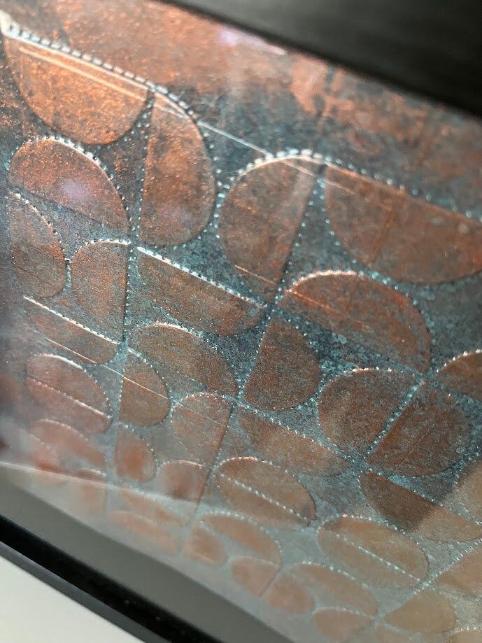 a close up of a window with circles on it