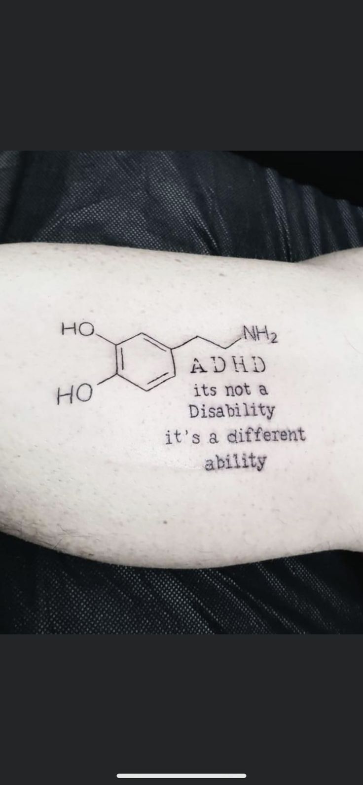 a person with a tattoo on their arm that says, it's different ability