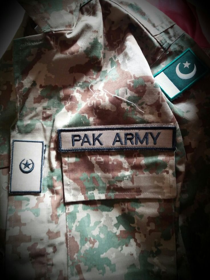 an army uniform with the flag of pakistan on it's chest and name tag