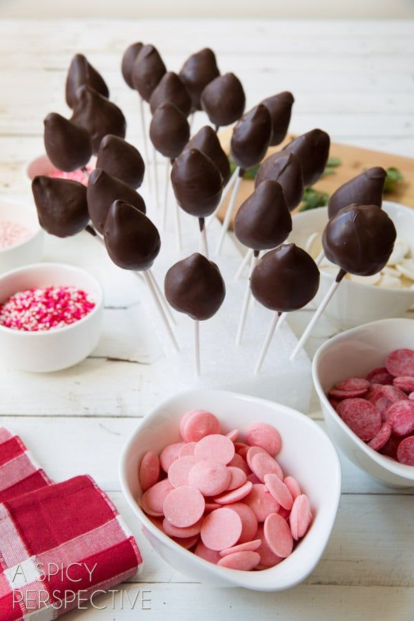 chocolate covered marshmallows in small bowls on a table