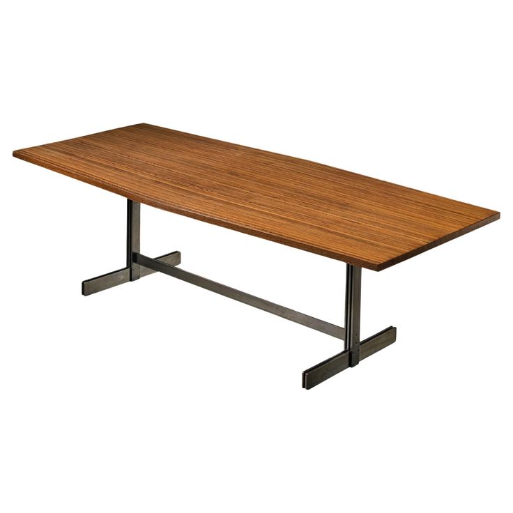 a wooden table sitting on top of a metal stand up leg in front of a white background