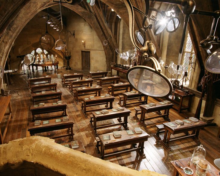 the inside of a restaurant with wooden tables and benches