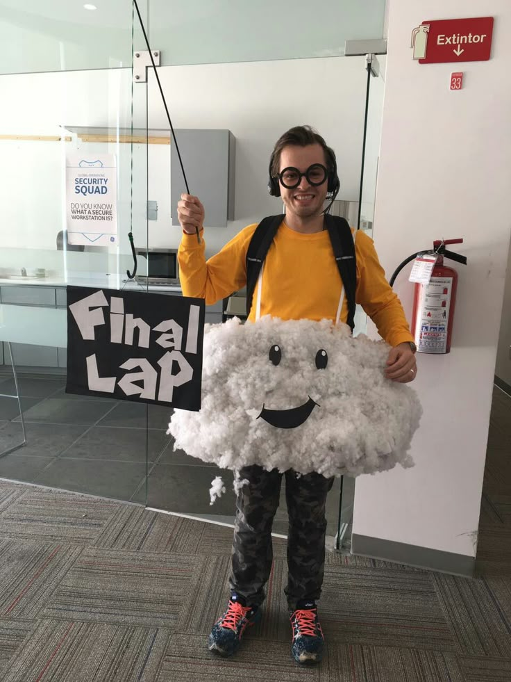 a young man is dressed up as a sheep and holding a sign that says final lap