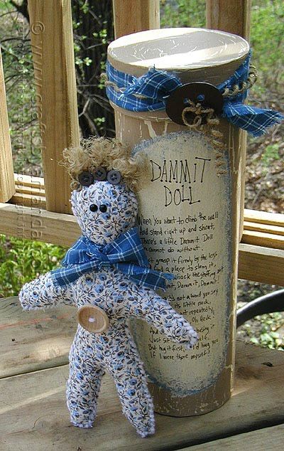 a teddy bear sitting on top of a wooden table next to a jar with writing