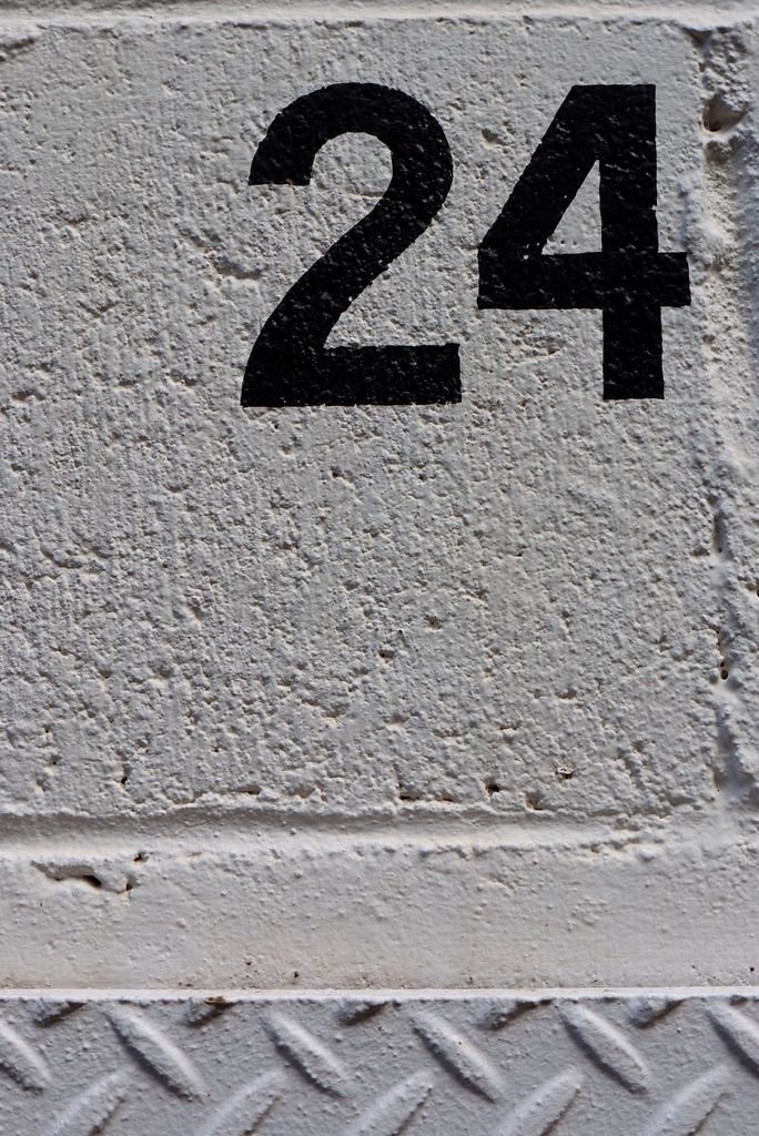 the number twenty four on a metal plate