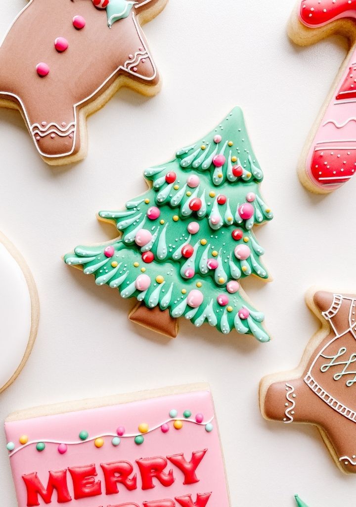 decorated christmas cookies on a white surface