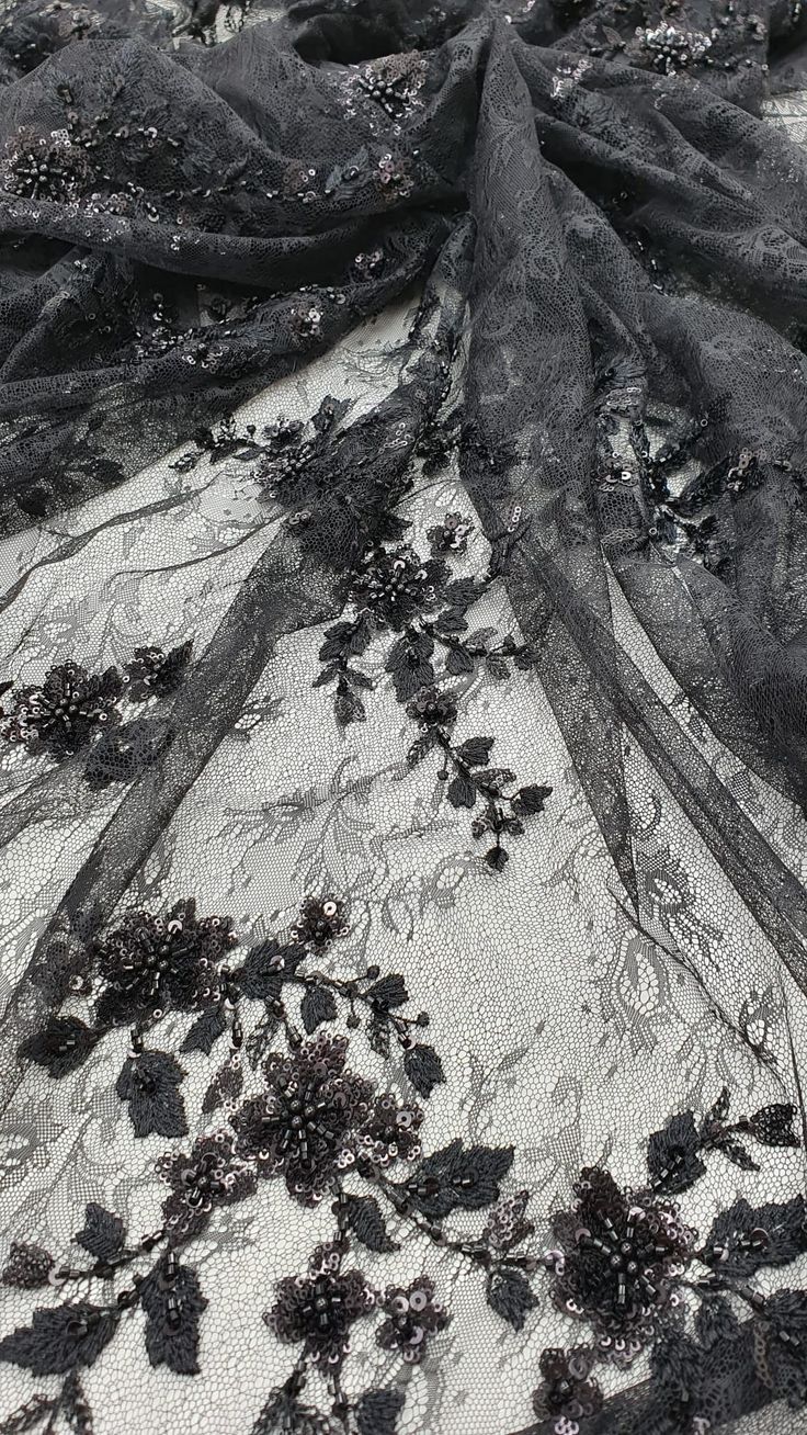 black lace with flowers on white fabric