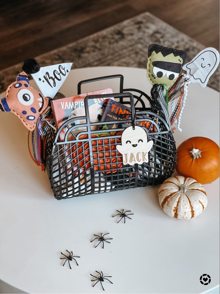 a basket filled with halloween items sitting on top of a table