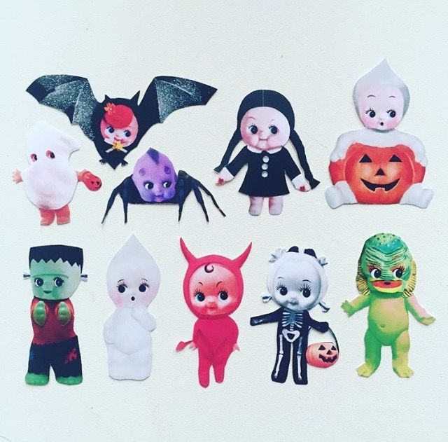 a group of halloween cut outs sitting on top of a white surface