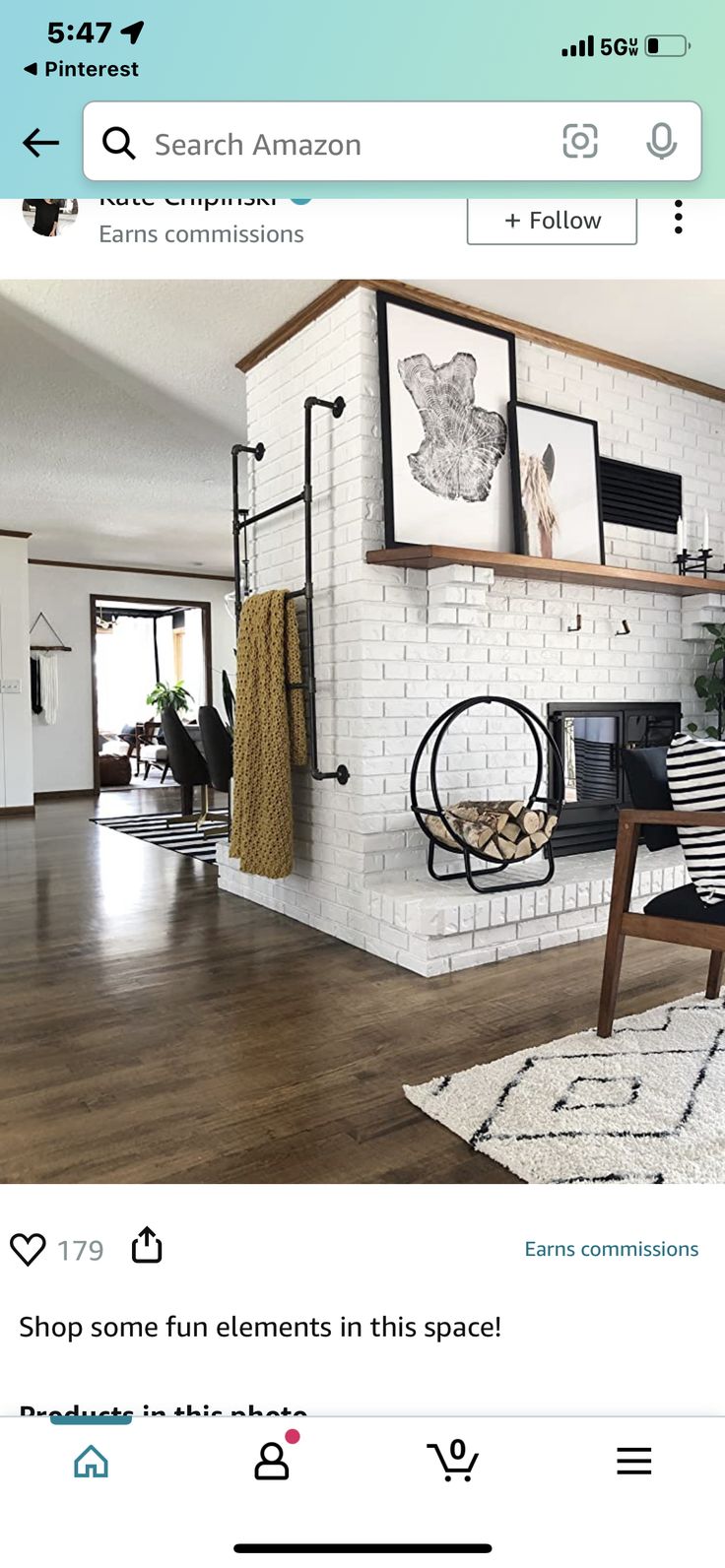 a living room with white brick walls and wood floors