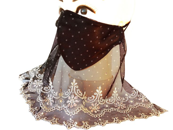 A chic black mask with a black lace veil embroidered with golden silk will not only protect you, but also become a glamorous decoration, add charm and self-confidence. The mask is anatomically shaped and does not require a nasal wire. The mask consists of two layers of pleasant to the touch beautiful soft satin, between which a cotton filter is sewn. The color of the mask can be chosen in variations. A black openwork veil embroidered with silk is sewn to the mask. The size of the mask is suitable for most faces. Doesn't interfere with breathing. Our masks are not medical. We do not have medical requirements for their use. Masks cannot be returned/exchanged due to hygiene reasons, but if you have any problems, please contact me, I can help you. Black Lace Veil, Face Mask Halloween, Lace Veil, Mask Halloween, Lace Veils, Black Mask, Self Confidence, Silk Satin, Veil