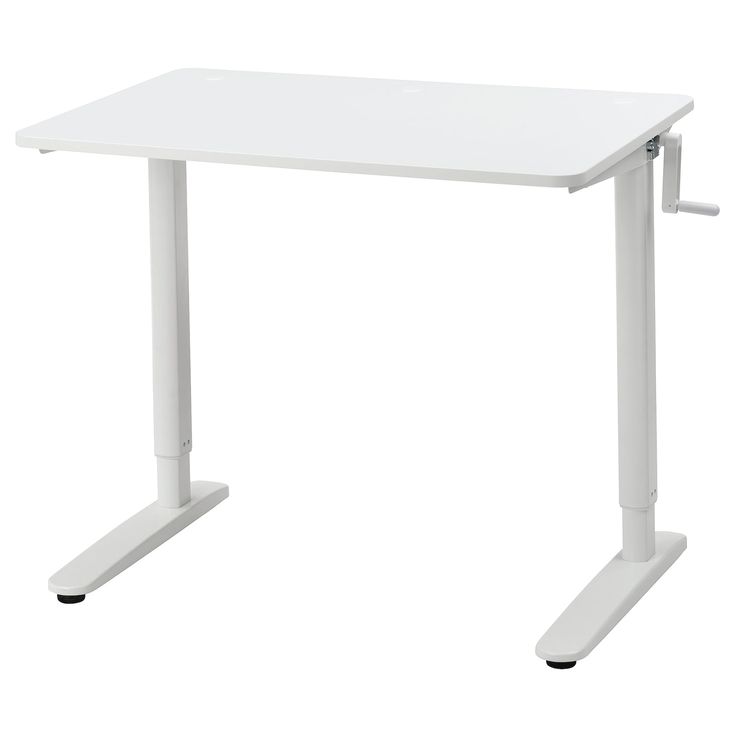 a white computer desk sitting on top of a table