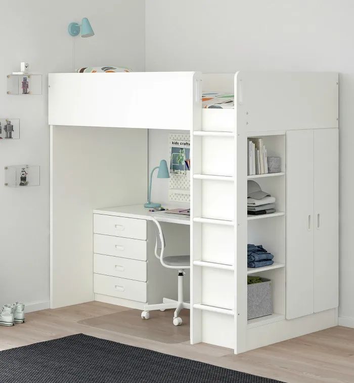 a white loft bed with desk and drawers in a child's playroom or bedroom