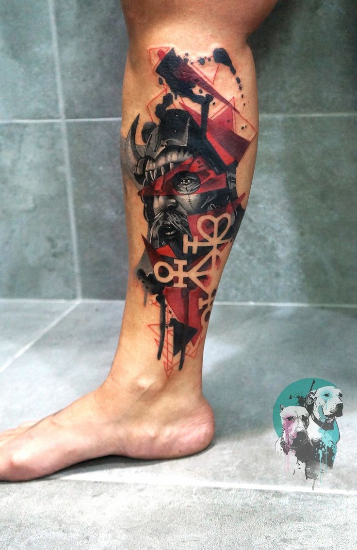 a man's leg with a tattoo on it that has an image of a demon