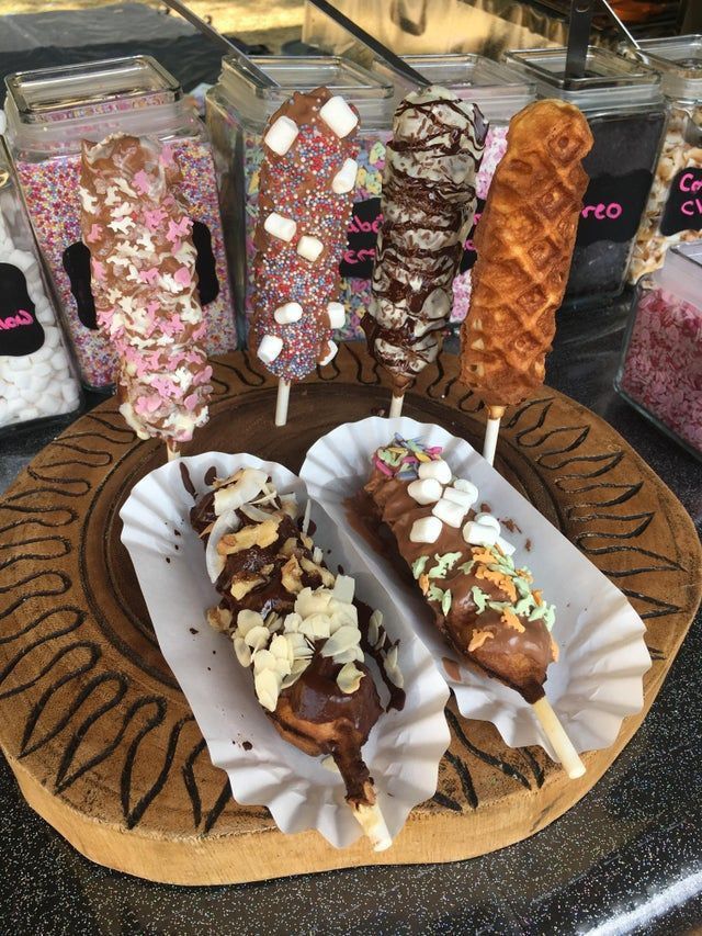 there are many different types of ice creams on the plate and one is covered in sprinkles