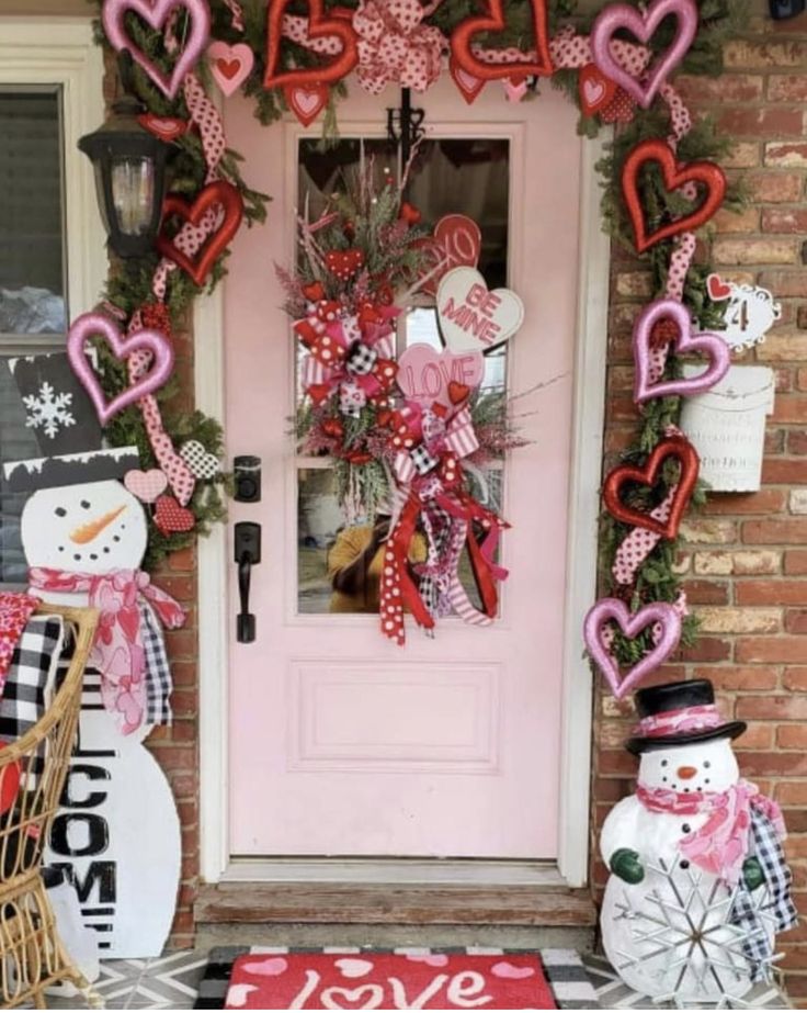 a front door decorated with hearts and snowmen for valentine's day or christmas