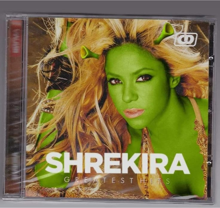 shekira greatest hits cd cover with blonde hair and green make - up on her face