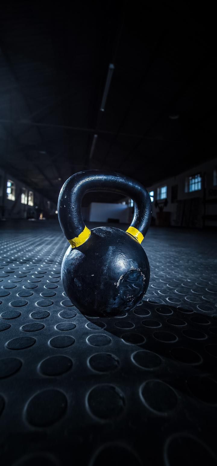 a black kettle sitting on top of a floor