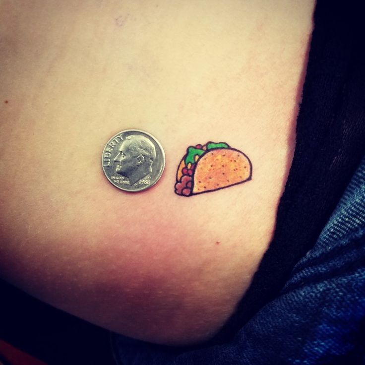 a small taco and a quarter penny are on the side of a woman's stomach