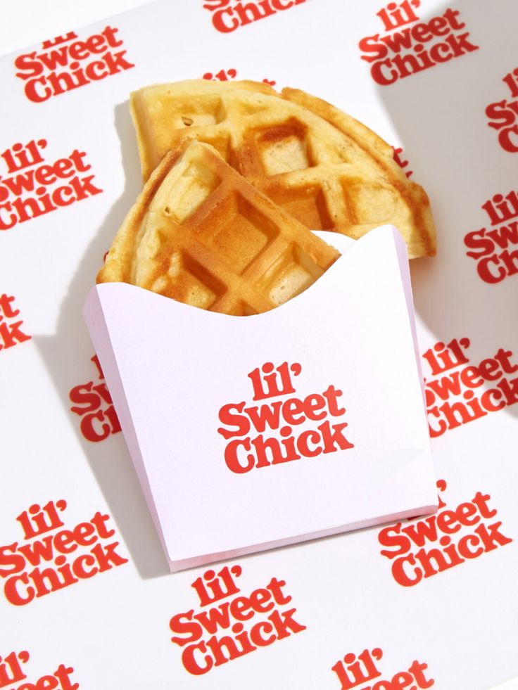 a waffle sitting on top of a white paper with the words if sweet chick