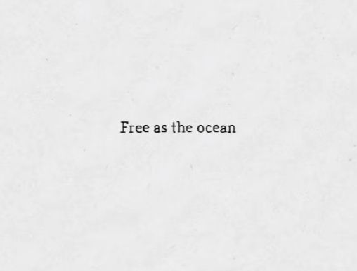 the words free as the ocean written in black ink