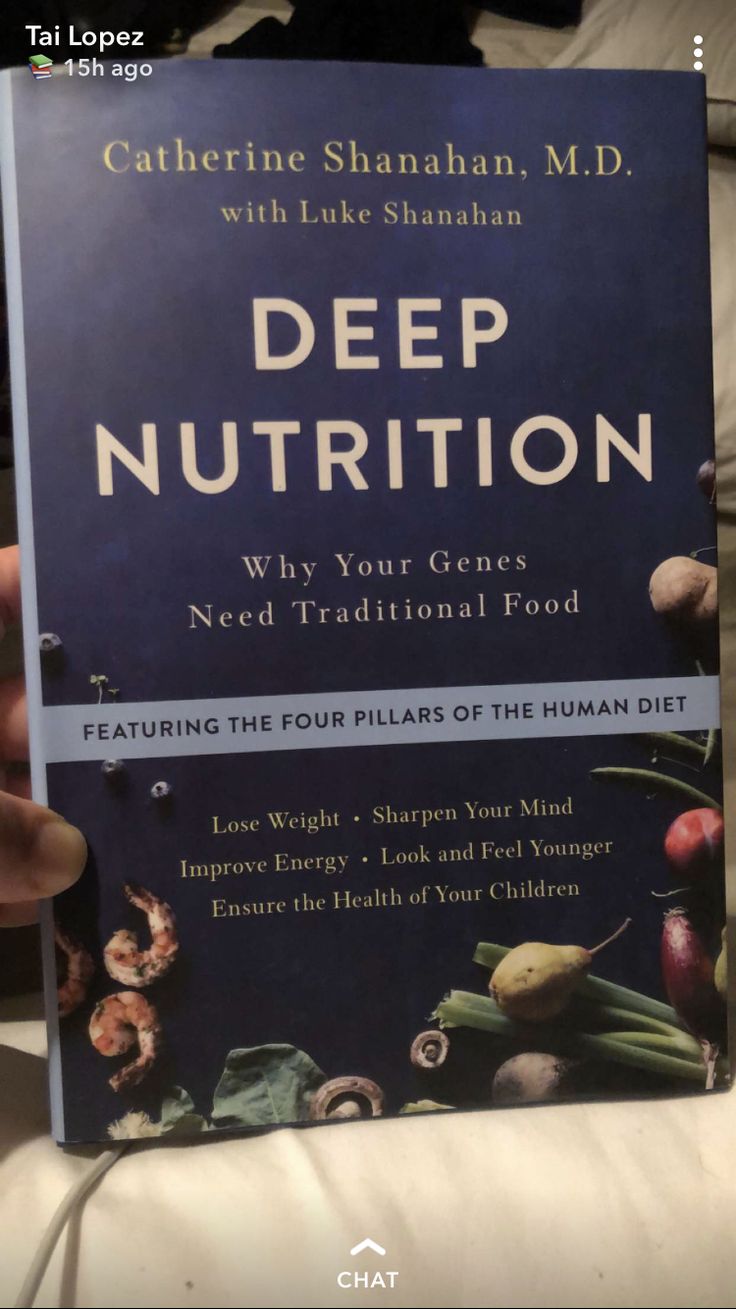 a person holding up a book about deep nutrition