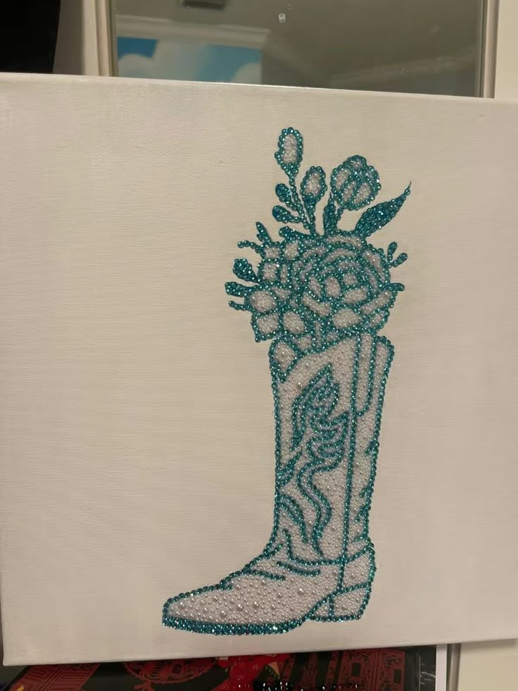 an image of a boot with flowers in it